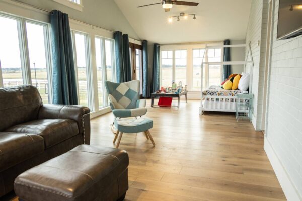 A well-furnished living room showcasing a couch, a chair, and a television, ideal for relaxation and leisure